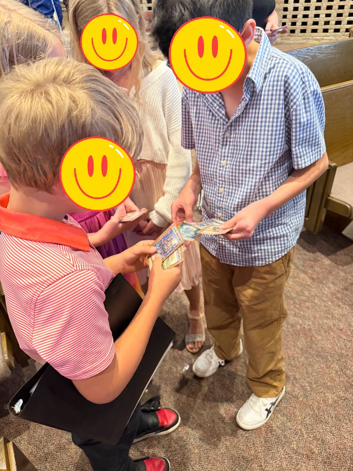 Kids at church trading their Faith Creatures cards after service